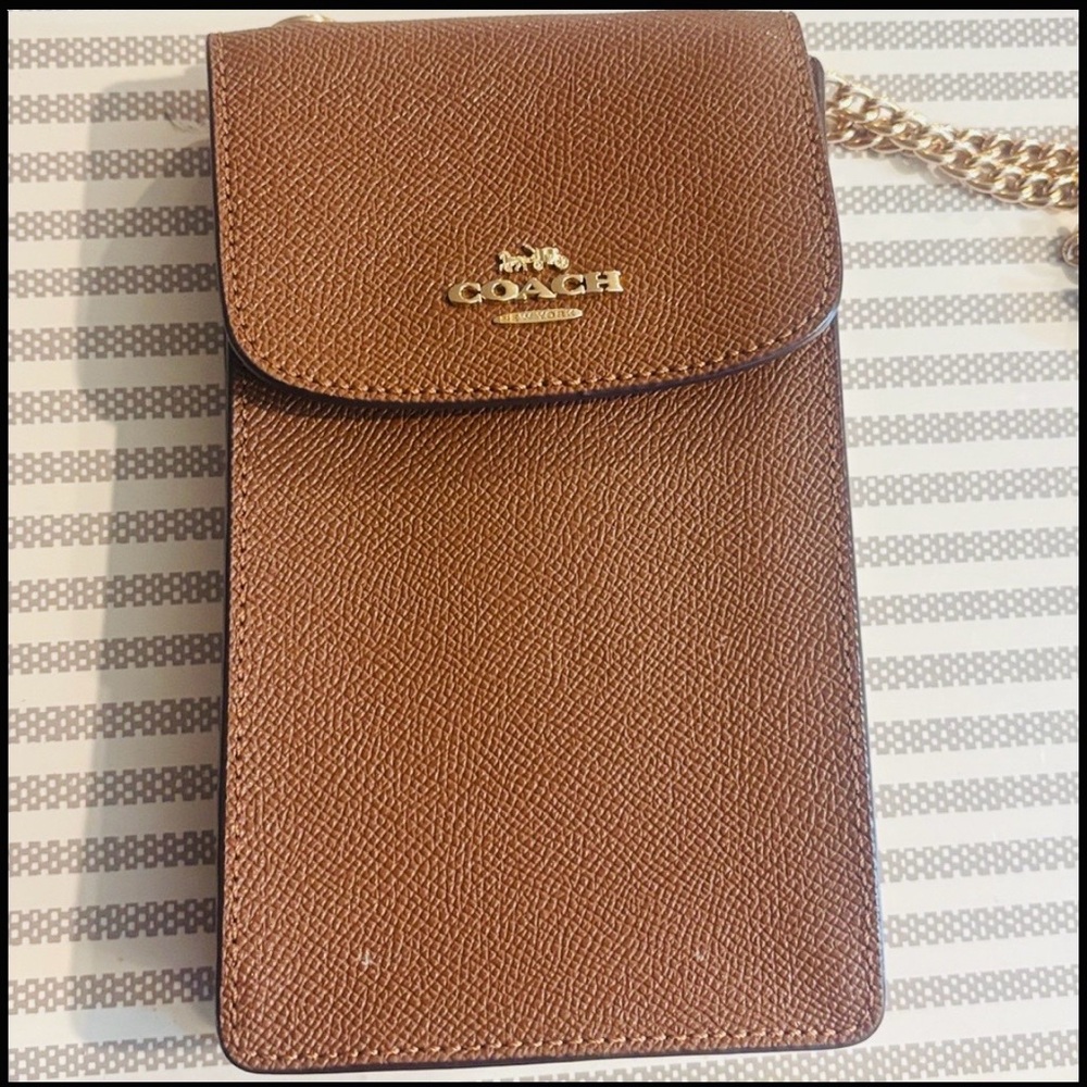 Coach brown cellphone crossbody bag with chain strap. In very good condition